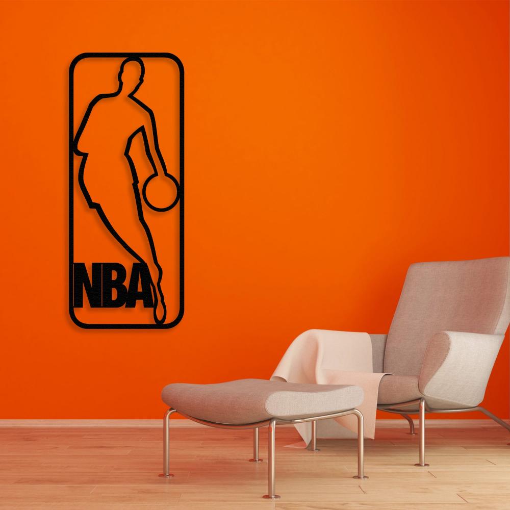 Black metal NBA wall art featuring a basketball player silhouette mounted on a vibrant orange wall, complemented by a modern chair and a minimalistic room design.