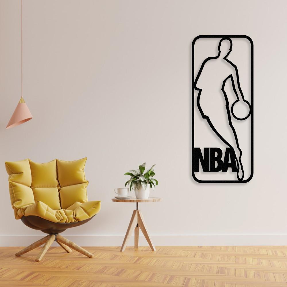 NBA-themed metal wall art featuring a basketball player silhouette, displayed in a modern interior with a mustard-yellow accent chair and a small plant on a side table/