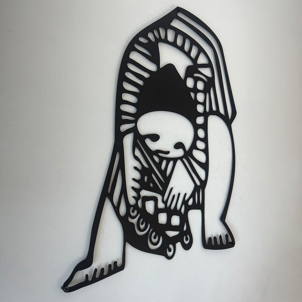 A close-up of a detailed black Picasso-style wall art piece, showcasing intricate patterns and artistic design elements on a plain white background.