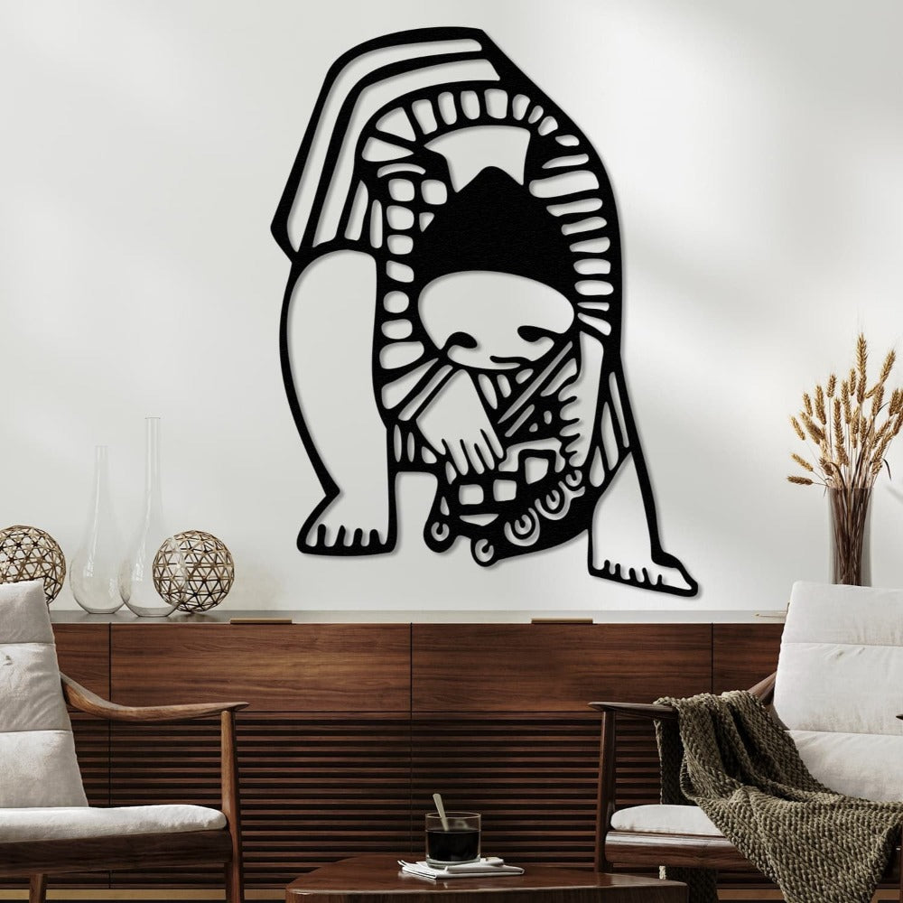 Artistic child-inspired metal wall art in black, positioned above a minimalist wooden console table with decorative vases and a cozy interior theme.