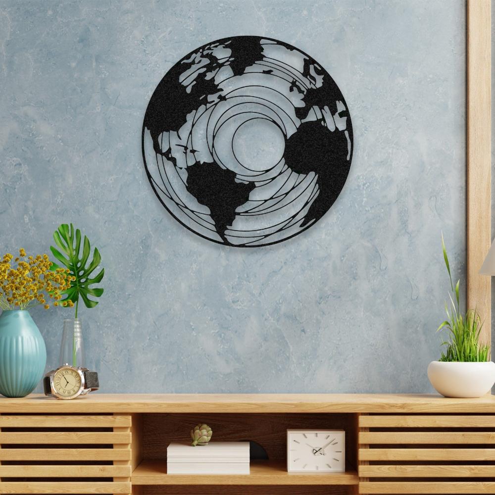 Round earth-themed metal wall art featuring a detailed map design with concentric patterns, mounted on a textured light blue wall above a wooden console table decorated with vases, a clock, and small plants.