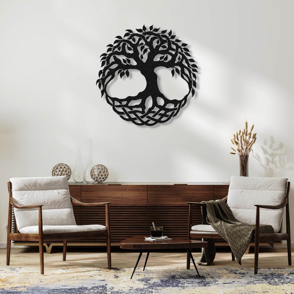 Round metal tree of life wall art featuring intricate branches and a Celtic-inspired base design, displayed in a modern living room above a wooden console table flanked by two cozy chairs.