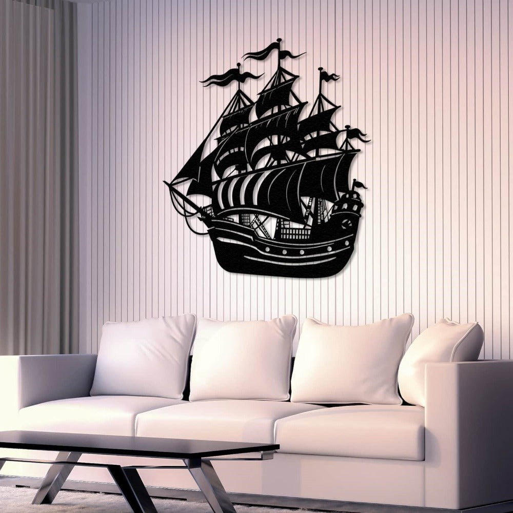 Black metal ship wall art featuring a detailed sailing vessel with multiple masts and flags, elegantly displayed above a modern white sofa in a minimalist living room.