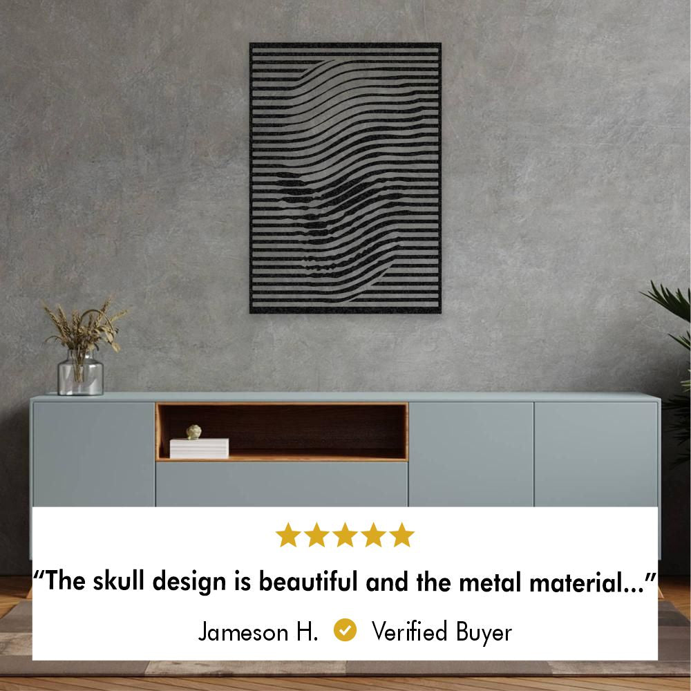 A living room with metal wall art featuring wavy black lines forming an optical illusion of a skull shape above a beige sofa with five star review “The skull design is beautiful and the metal material…” by Jameson H. Verified Buyer.