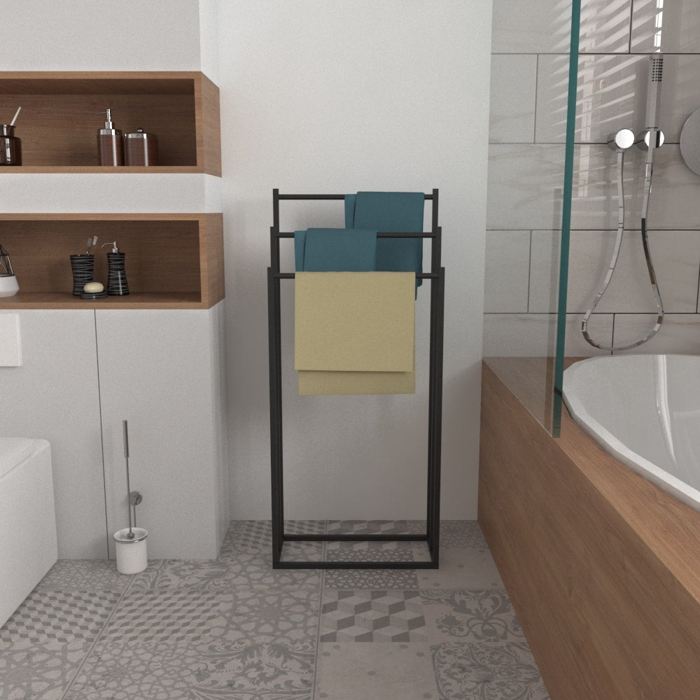 A modern free-standing towel rack with towels neatly arranged, complementing a bathroom with wooden accents and white tiles.