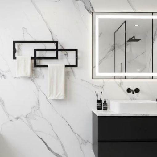 Modern bathroom with marble walls, black fixtures, and a mirror.