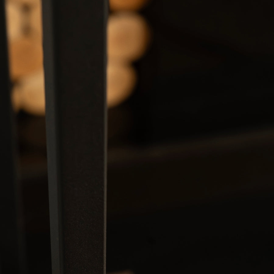 Close-up of a black metal bar with a blurred background