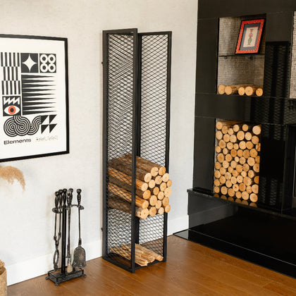 Fireplace with wood storage rack, fireplace tools, and decorative elements. tall firewood rack for fireplace, large capacity firewood storage