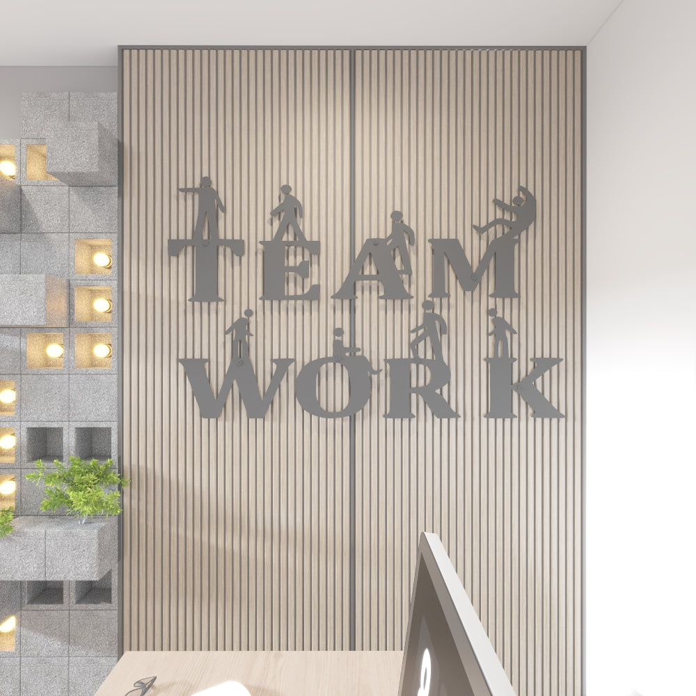 Decorative wall art with 'TEAM WORK' text and silhouettes on a striped wall.