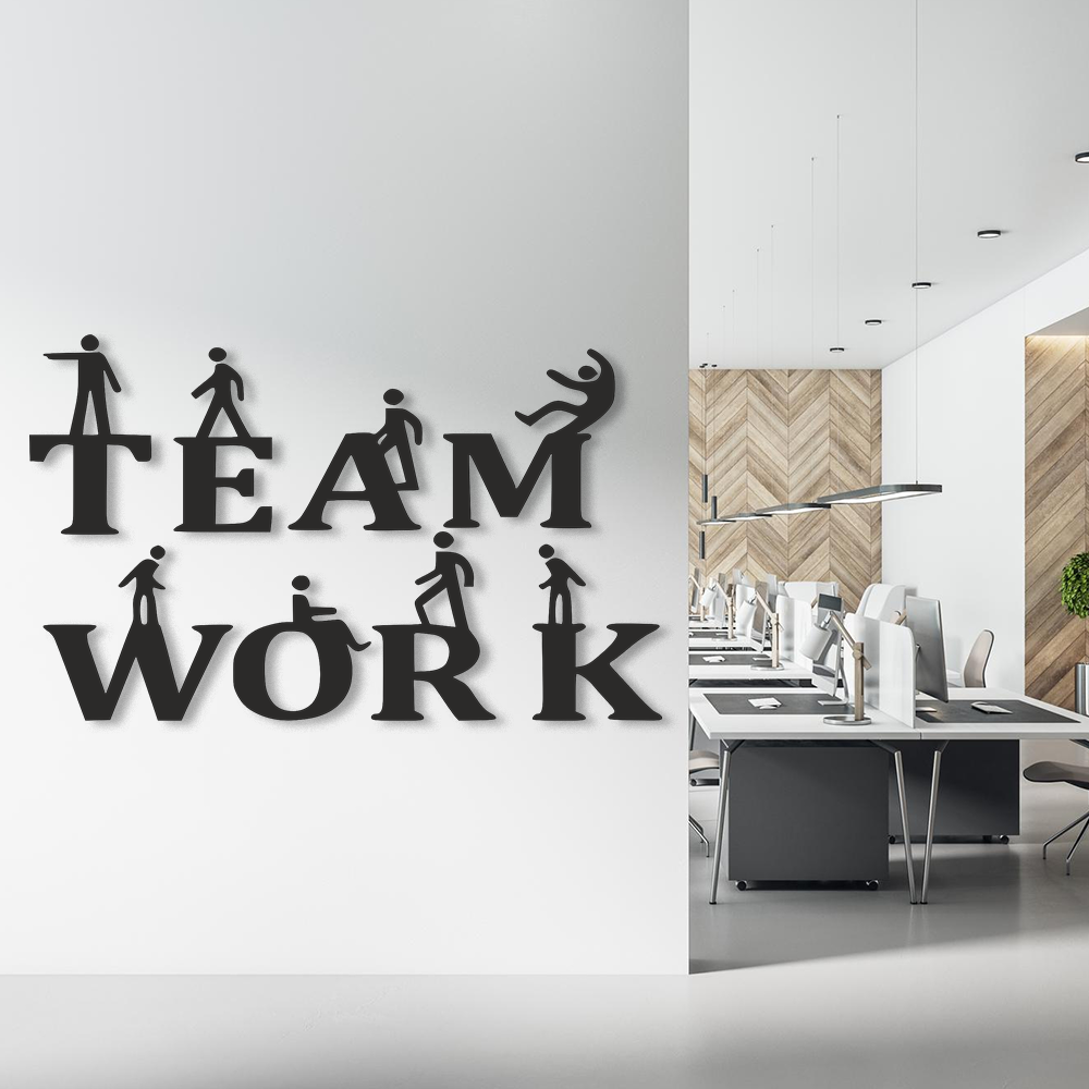 Decorative wall art with 'TEAM WORK' on a wall in an office setting.