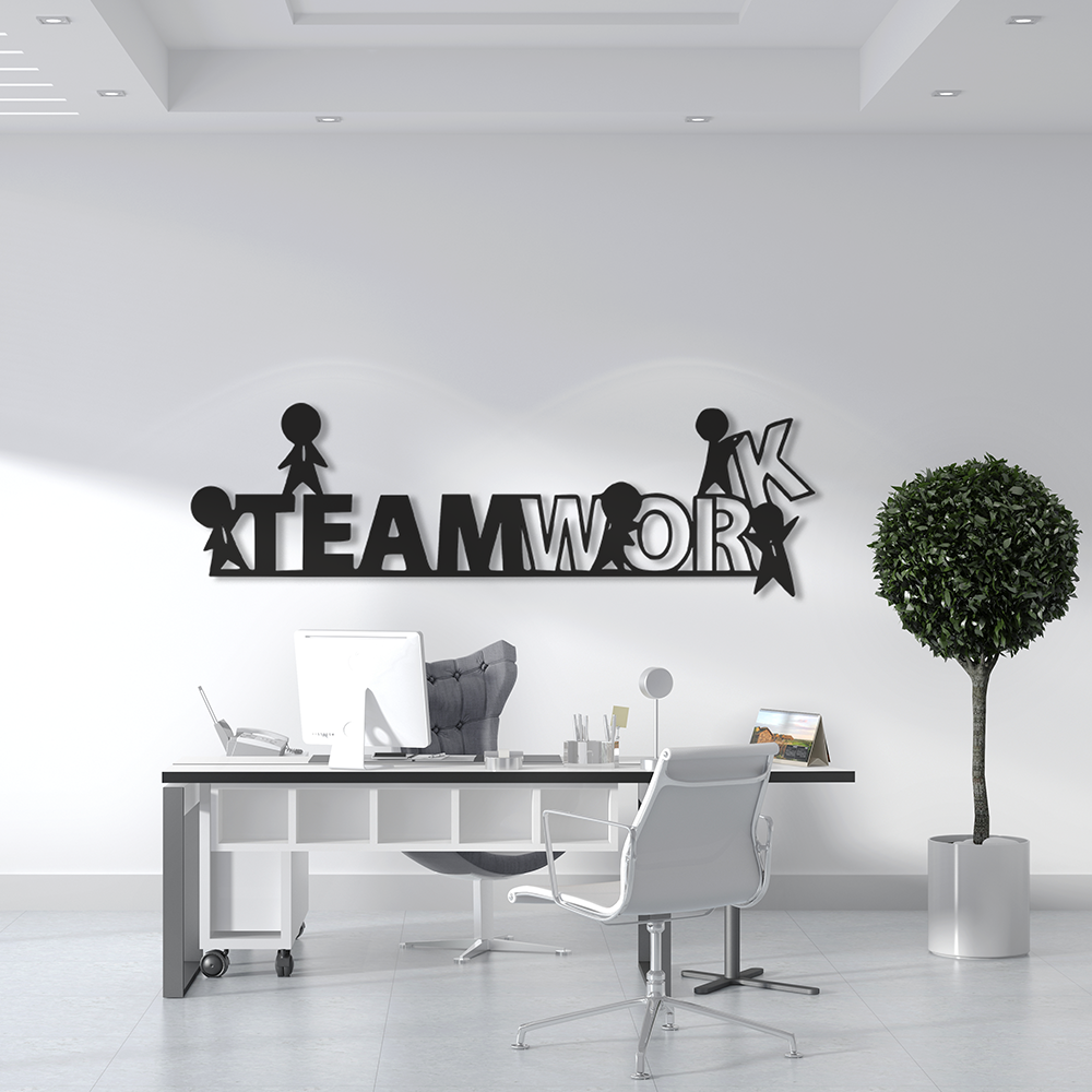 Modern office interior with a 'TEAMWORK' wall decoration.