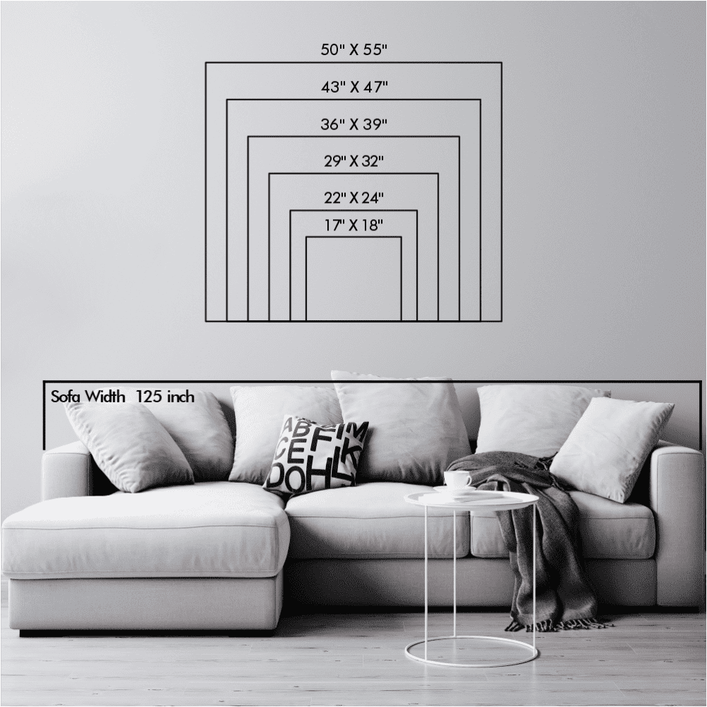 A size chart for metal wall art, showing various dimensions ranging from 17"x18" to 50"x55," placed above a sofa for scale reference.