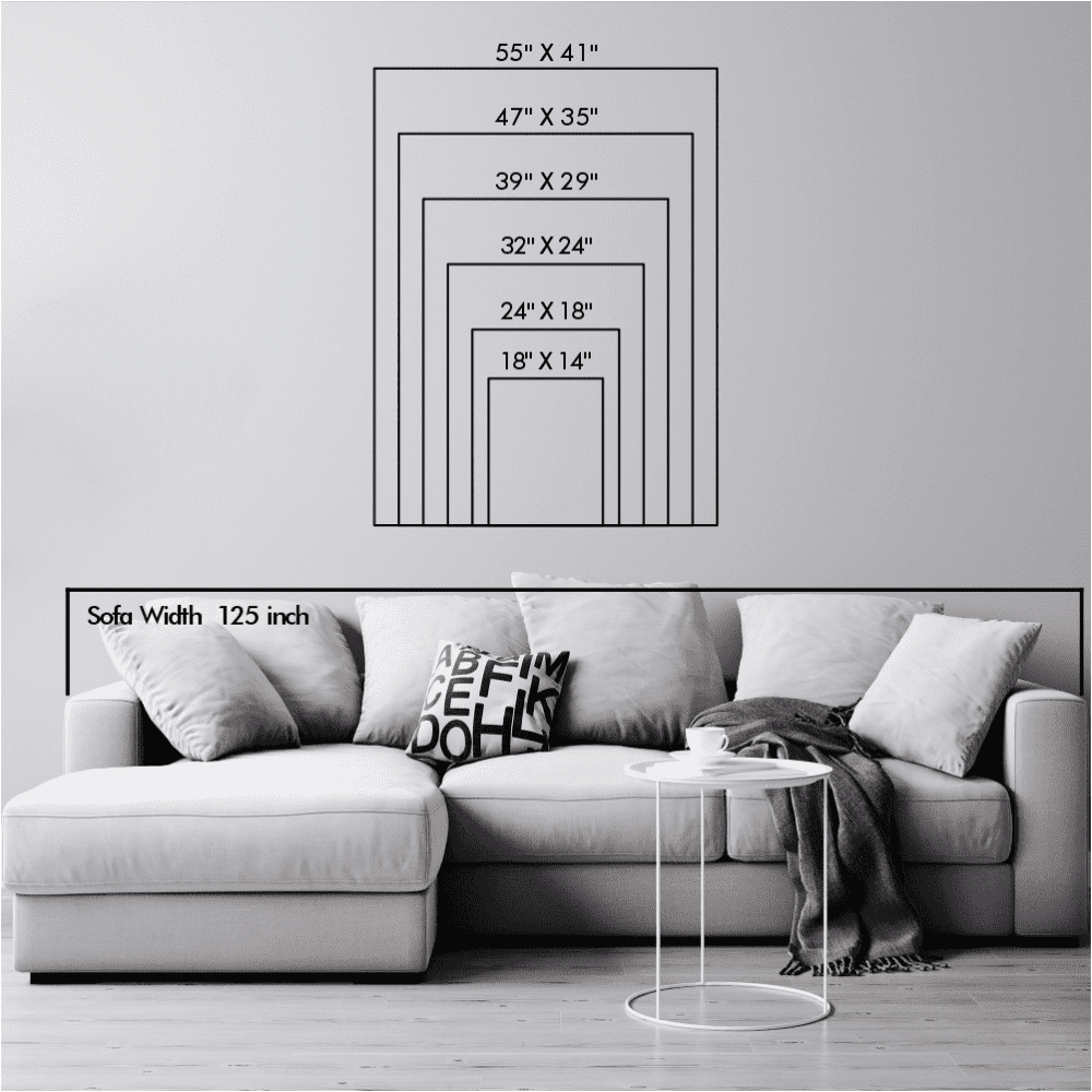Size chart showcasing various dimensions of wall art, ranging from 18" x 14" to 55" x 41", displayed above a 125-inch wide sofa for scale in a minimalist living room with a coffee table and cushions.