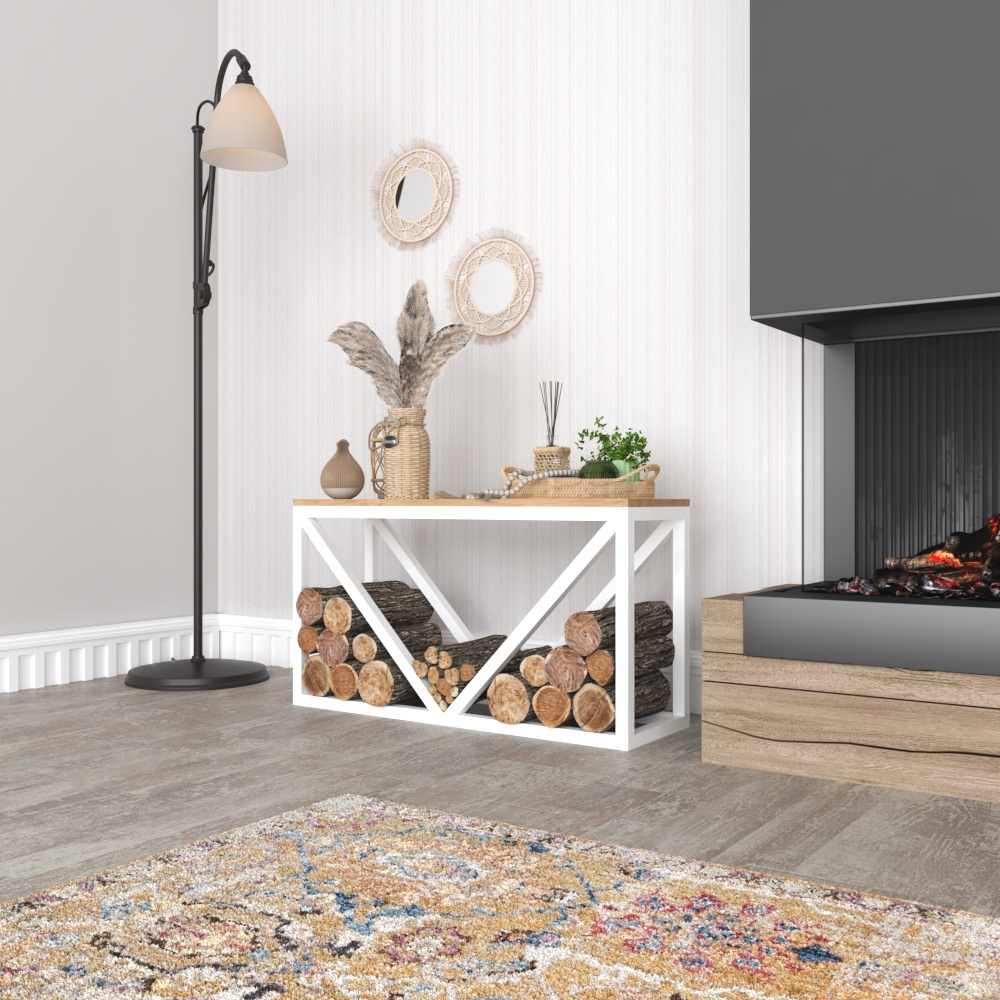 A white metal wood rack with a wooden top, neatly stacked firewood below, and decorative items on the surface, placed in a cozy indoor setting next to a fireplace.