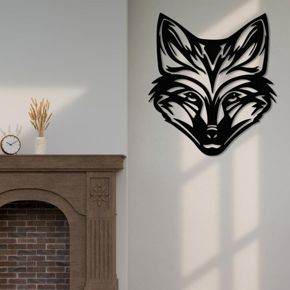 black metal wild fox wall art mounted on a light-colored wall beside a traditional wooden fireplace with brick accents, decorated with a small clock and vase of dried wheat. The sunlight casts soft shadows, creating a cozy living room ambiance.