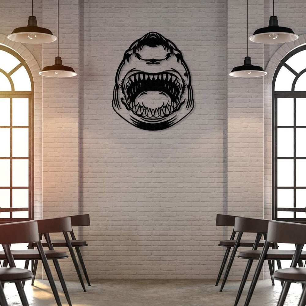 Black shark metal wall art displayed on a white brick wall in an industrial-style space with pendant lights and modern chairs.