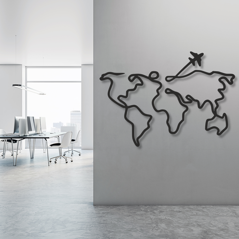 World map wall decoration with an airplane on a gray wall in an office setting