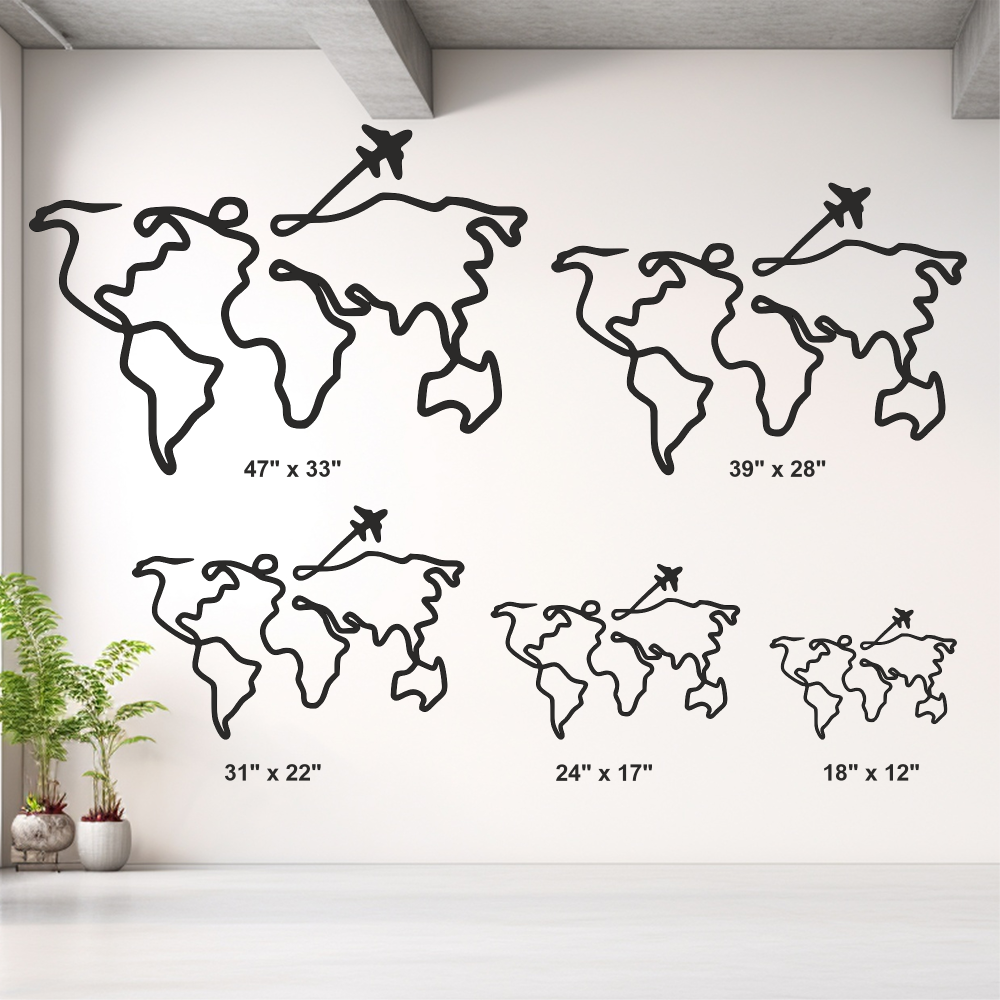 Set of world map wall decor in various sizes on a white wall.