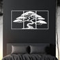 Three-piece white metal wall art featuring a bonsai tree with intricate details, mounted on a dark black wall. The artwork is placed above a modern bed with black bedding, creating a bold and minimalist bedroom aesthetic.