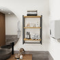 3-tier bathroom shelf and towel holder styled with towels and decorative items.