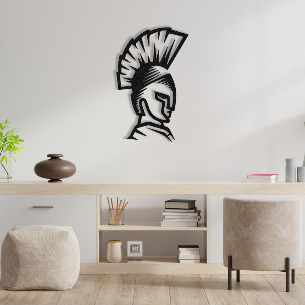 Black Spartan helmet wall art showcased on a white wall above a light wood desk with minimalist decor.