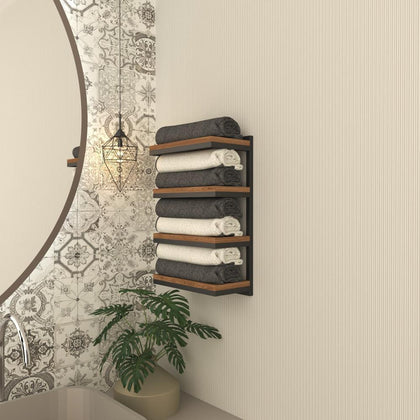  A 4-tier towel stacker with a sleek black metal frame and wooden shelves, neatly holding rolled gray and white towels in a stylish bathroom with patterned tiles.