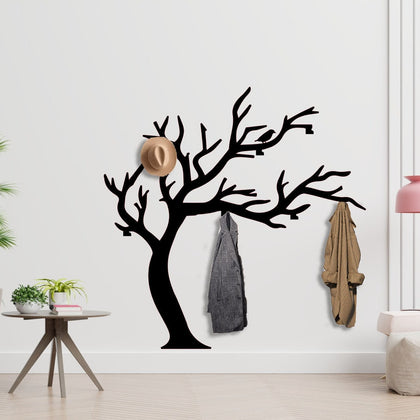 Tree Branch Shaped Coat Rack with hanging coats, demonstrating capacity in an entryway setting.