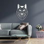 Geometric wolf head metal wall art in white, mounted on a dark gray wall above a light gray modern sofa. The decor is complemented by a pink wireframe side table with a bouquet of white roses and a gold-accented coffee table on a wooden floor.