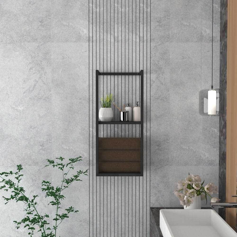 A modern bathroom with a black floating shelf installed next to a sink area, displaying rolled towels and minimalistic decor items