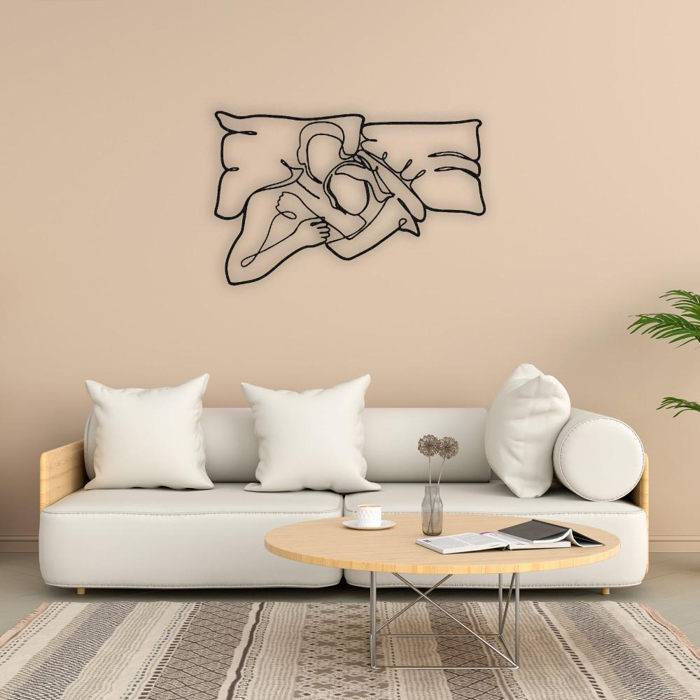 Black Romantic Lying Couple Line Art Metal Wall Art in a living room