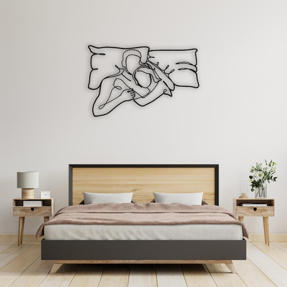 Black Romantic Lying Couple Line Art Metal Wall Art in a bedroom