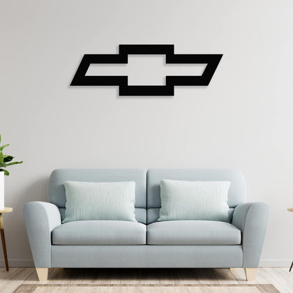 chevrolet metal wall art decor on the sofa