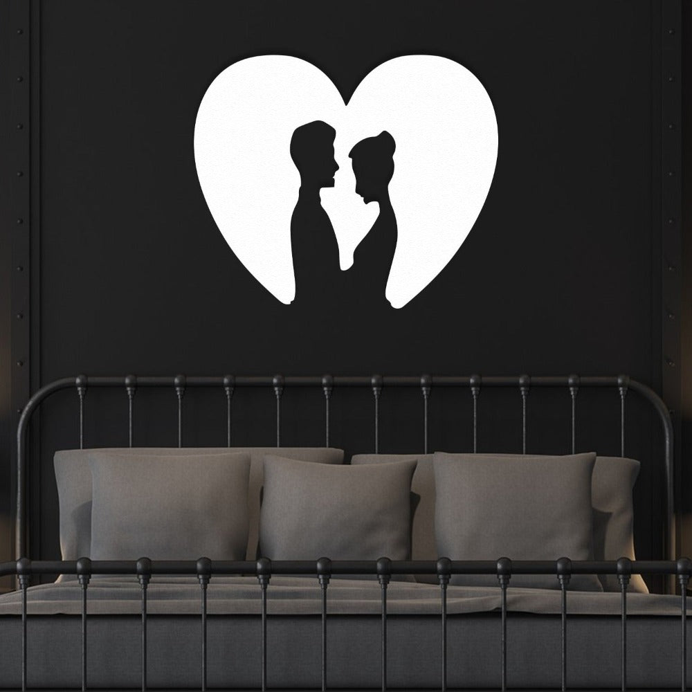 White Couple Heart Silhouette Metal Wall Art in a bedroom