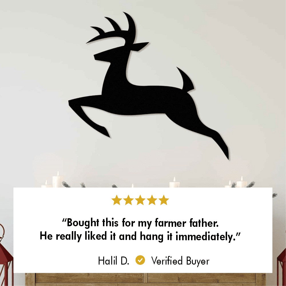 A large metal wall art of a leaping deer, mounted above a cozy fireplace.
