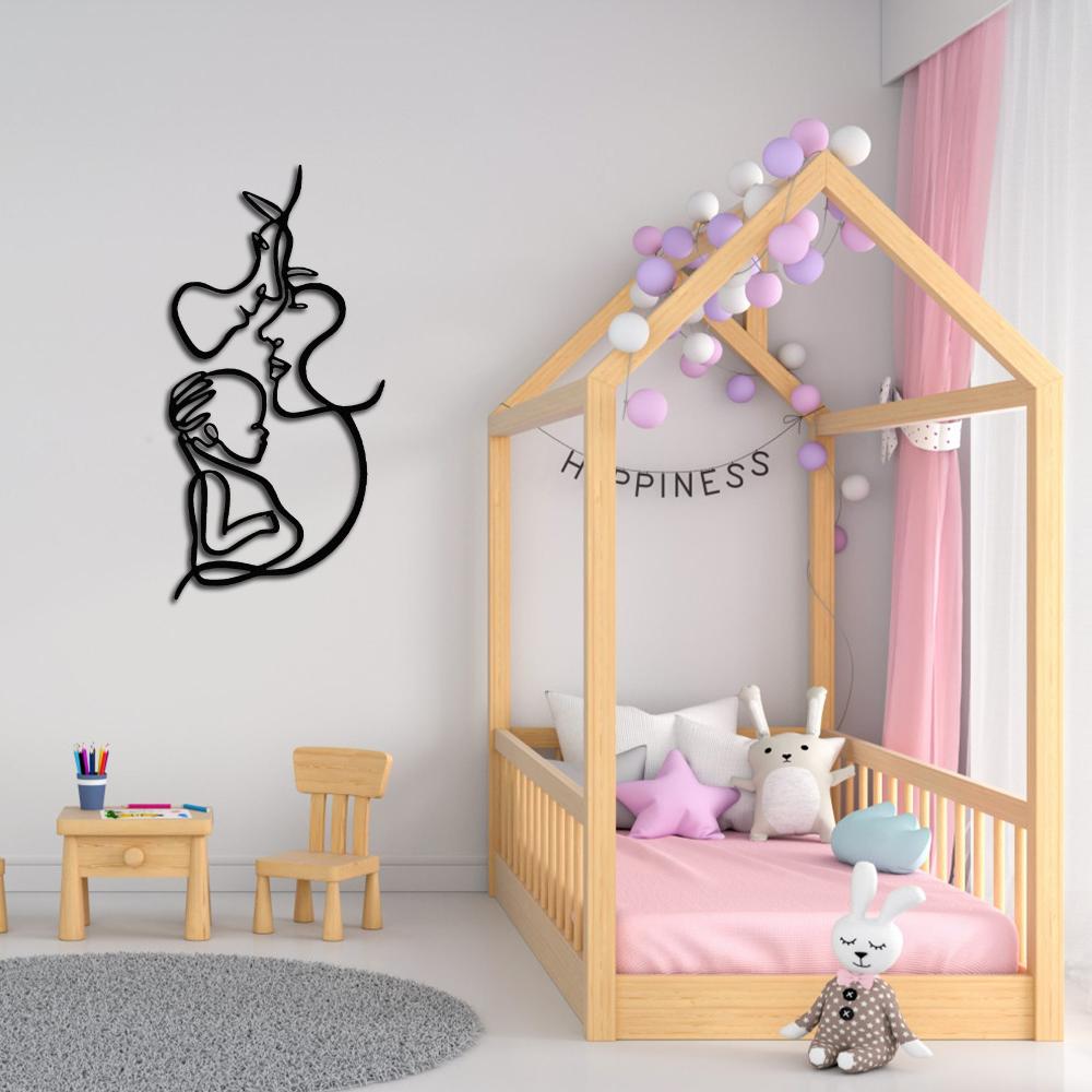 Modern line art wall decor of a family trio, placed in a pastel-themed children’s bedroom with a play area.
