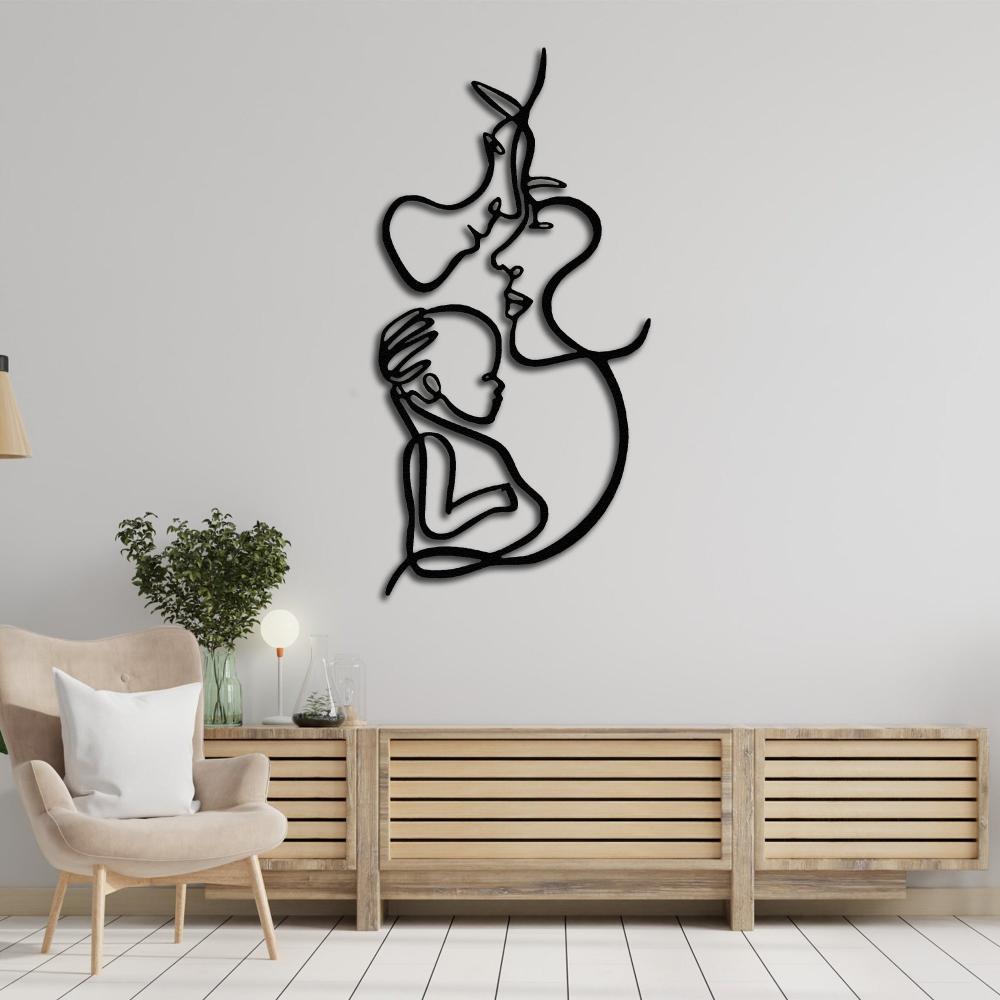 Minimalist line art wall sculpture of a mother, father, and child, displayed in a cozy living room with natural wood decor.