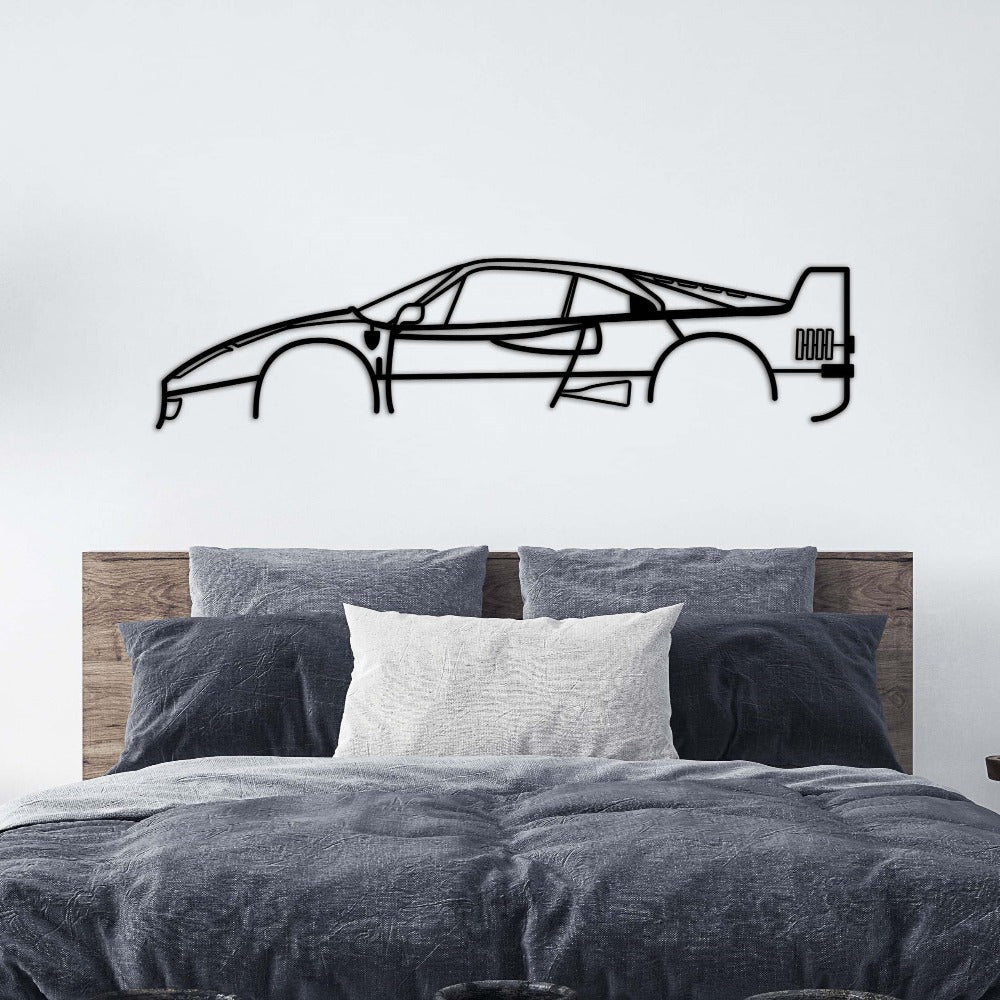 Ferrari F40 car silhouette metal wall art displayed above a bed.