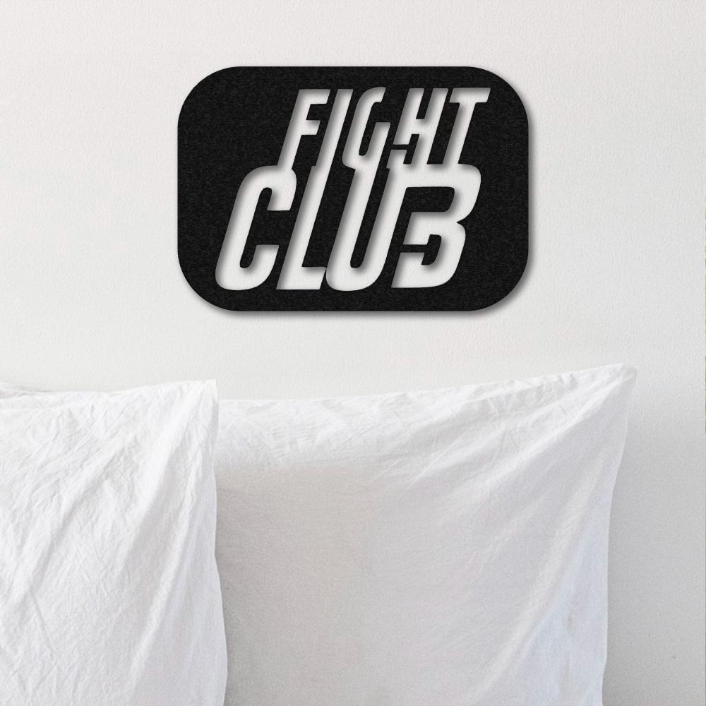 Fight Club-themed black metal wall art with bold 3D typography, mounted above crisp white pillows on a minimalist white wall.