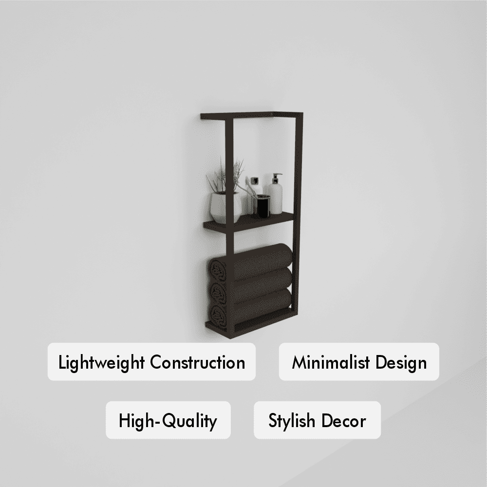 Wall-mounted black metal floating shelf featuring a minimalist design with two tiers. The top shelf holds a modern white ceramic planter with greenery and various bathroom essentials. The bottom section neatly stores rolled towels.