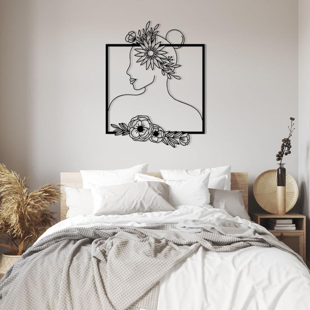 Black Floral Woman Silhouette Metal Wall Art in a bedroom