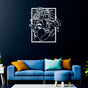 hite metal wall art of a woman's face with floral designs, mounted on a navy blue wall in a cozy living room with colorful cushions on a blue sofa.