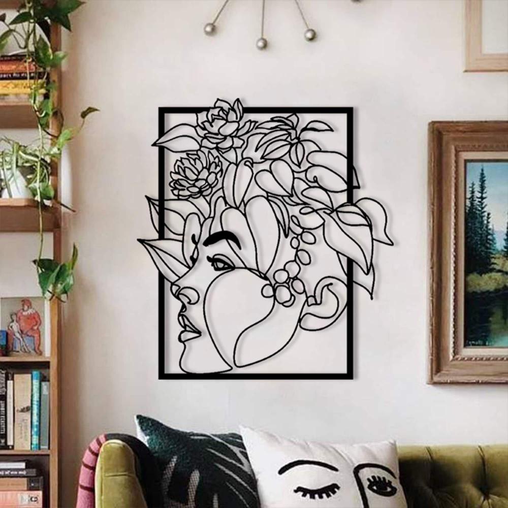 Floral Woman Face Metal Wall Art in a living room
