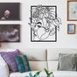 Modern metal wall art of a woman’s face with floral accents, showcased in a living room with white furniture and colorful throw pillows.