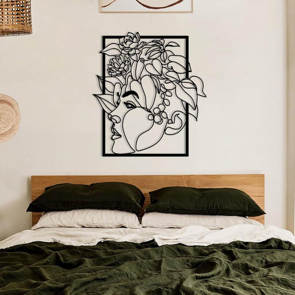 Floral Woman Face Metal Wall Art in a bedroom