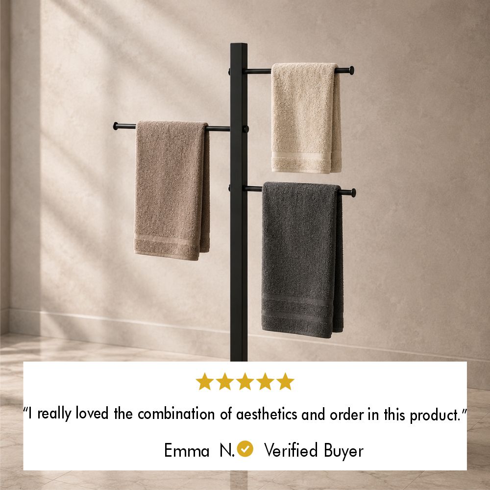 Five-star customer review from verified buyer Emma N. saying the freestanding towel stand combines aesthetics and order.