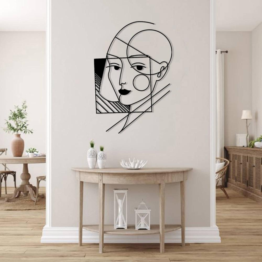 A geometric lady wall art showcased in a classic entryway above a wooden console table with decorative items.