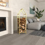 Gold house shaped firewood rack neatly holding firewood, placed in a stylish living room with neutral tones and contemporary decor