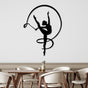 A modern dining area with a gymnast girl metal wall decor featuring a ribbon dance silhouette in black, mounted on a white wall, above a wooden table with elegant chairs