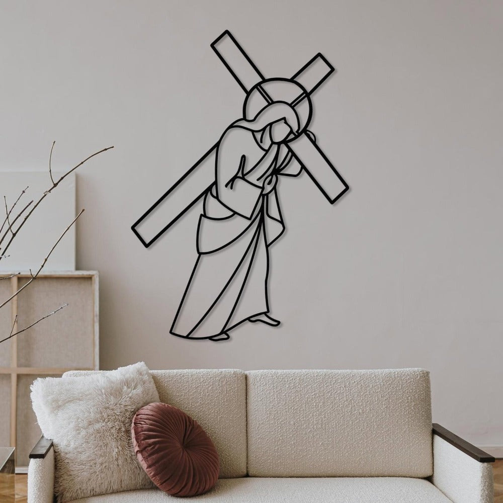 Black Jesus Carrying Cross Metal Wall Art in a living room