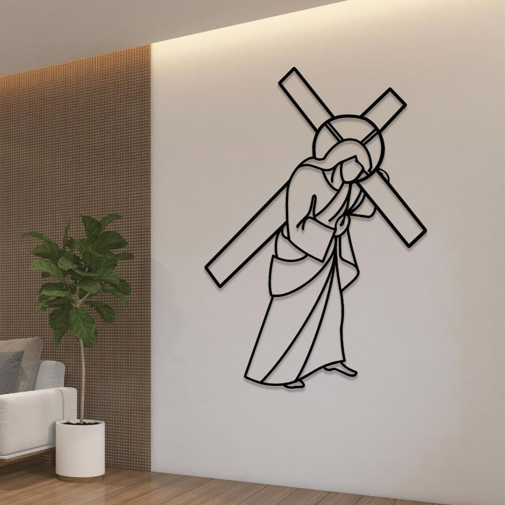 Black Jesus Carrying Cross Metal Wall Art in a living room